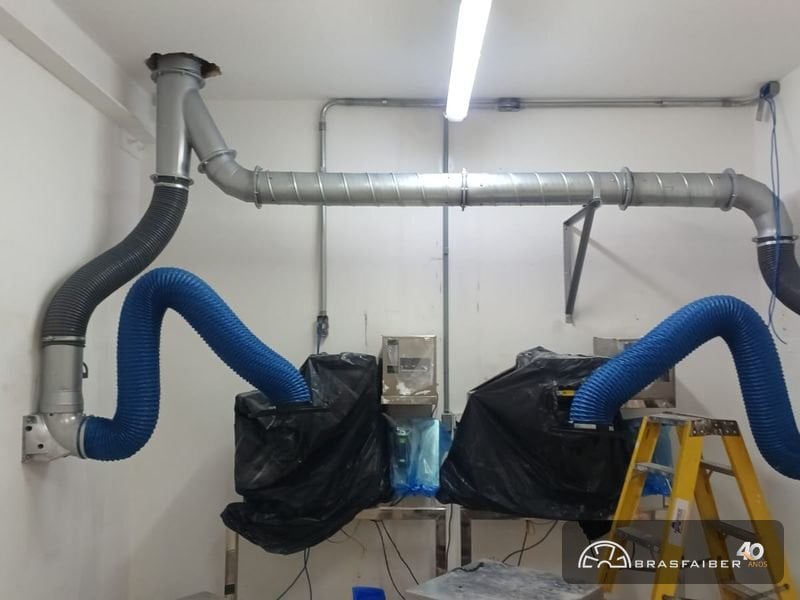 Captação de pó na fonte com sistema de dutos